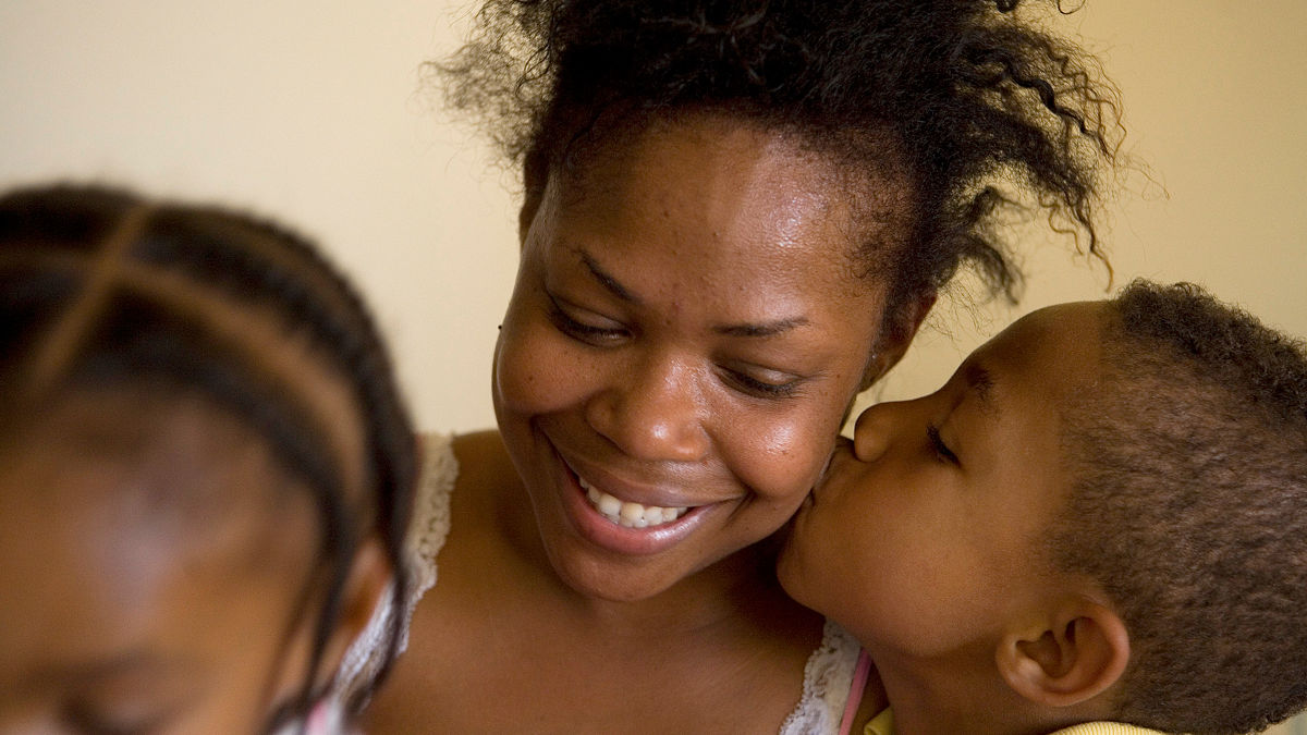 Beverly Davis, a single mother and her children, Alyla (daughter) and Semaj (son). Beverly suffers from Crohn's Disease.  Commission to Build a Healthier America - Beverly Davis. Long Beach, California.