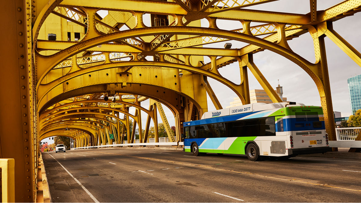 A city bus crosses the Tower Bridge in Sacramento