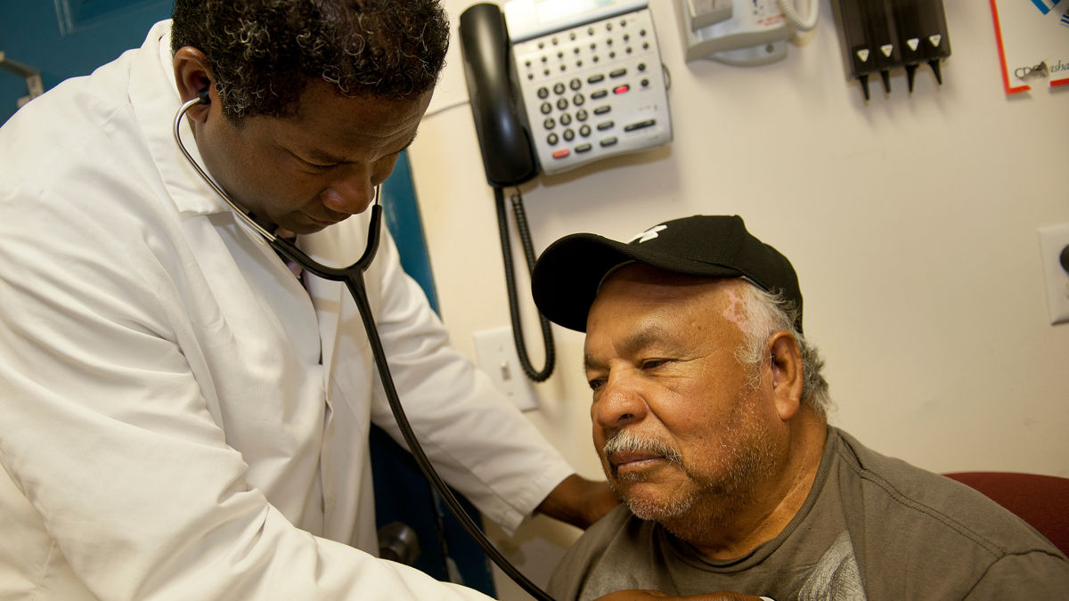 NEW PALTZ, NEW YORK: Migrant farm worker, Armando (Release #7), receives a check up from Dr. St. Louis, left, (Release #9) at the Hudson River Health Care Migrant Clinic in New Paltz, NY.  Armando was there to take advantage of a clinic night dedicated to diabetes treatment.