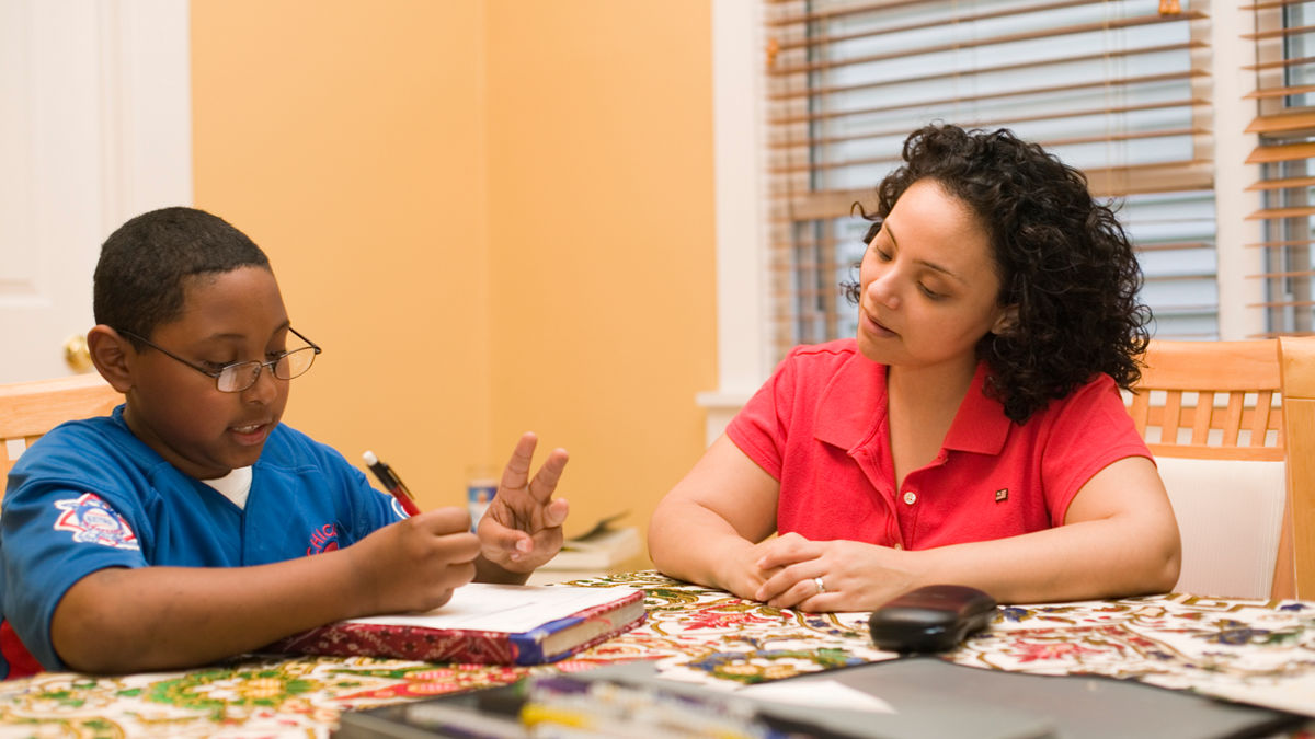 Esther Lopez and her nephew. Lopez, a dental student at the University of Illinois at Chicago, participates in the Pipeline, Profession and Practice.