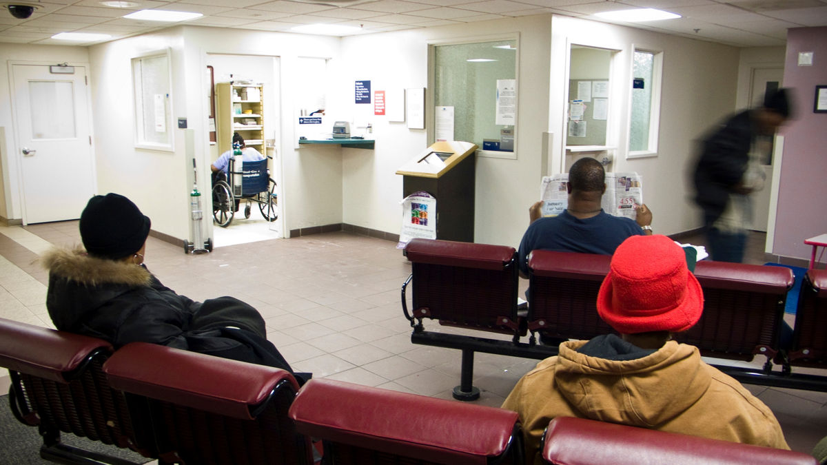 People sitting in a hospital waiting room.  Expecting Success