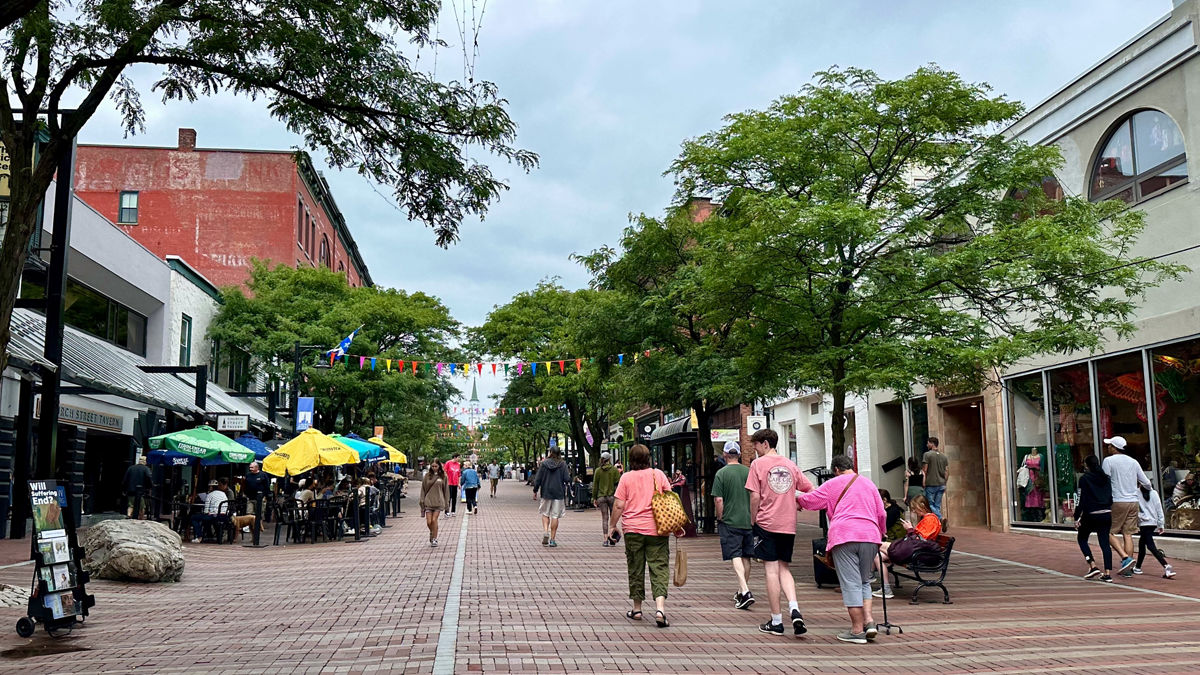 People walk down Church Street, a pedestrian only area, in downtown Burlington, Vermont.