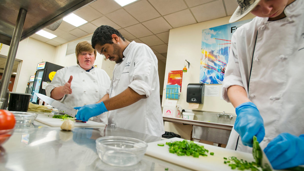 Chef students working in a kitchen.