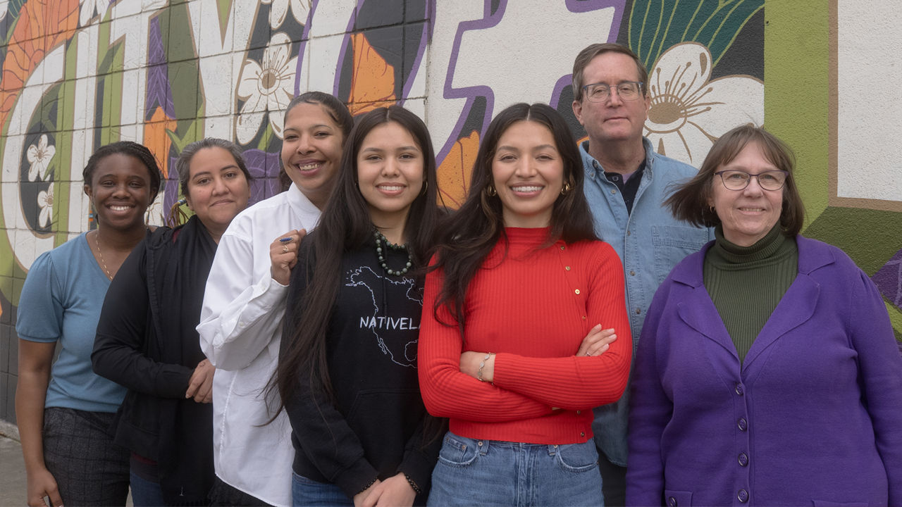 A team photo of Youth Forward at their oﬃce in Sacramento, Sarah Michael Gaston, Donna Miranda-Begay, Nia Moore-Weather, Lozen Miranda-Brightman, Monica Ruelas Mares, Jim Keddy and Barbara Harris.