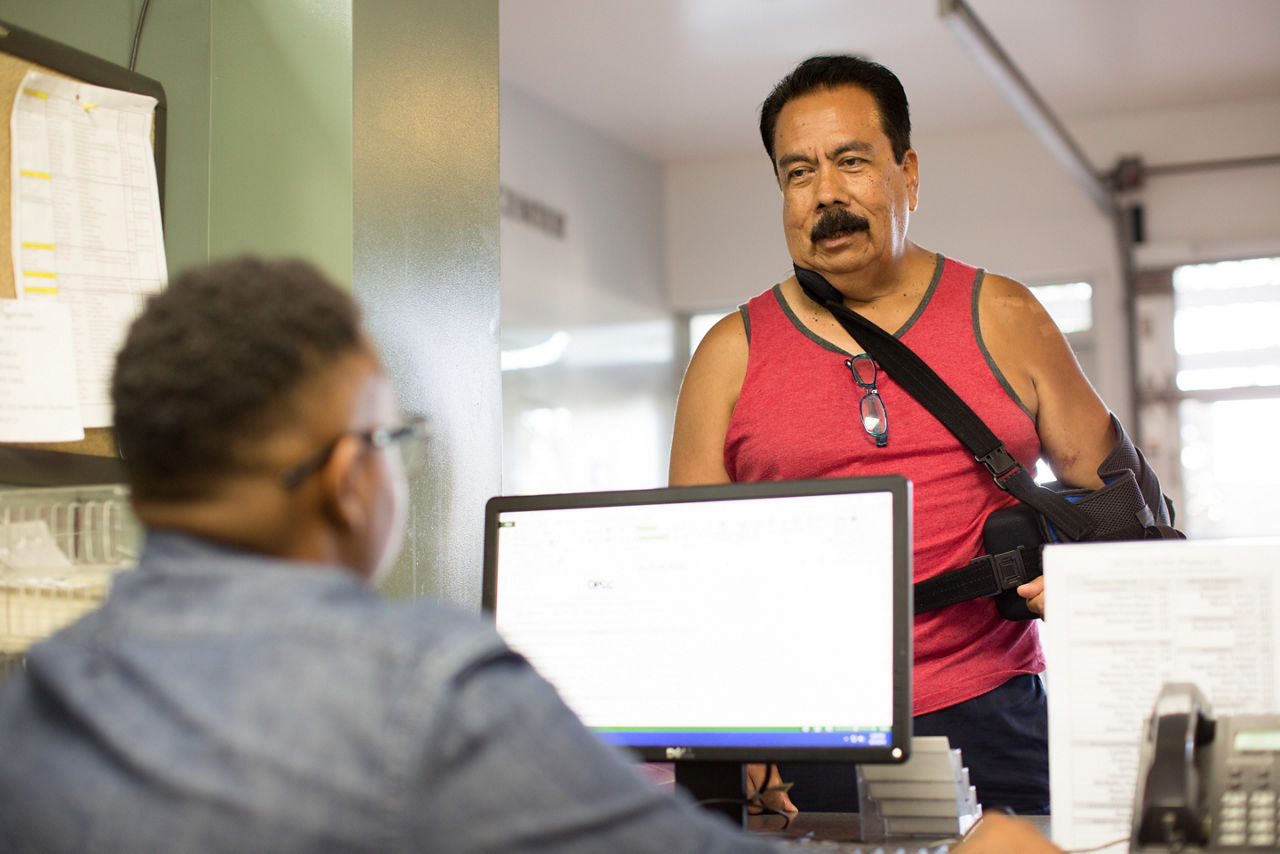 A man receives assistance at a homeless intake facility.