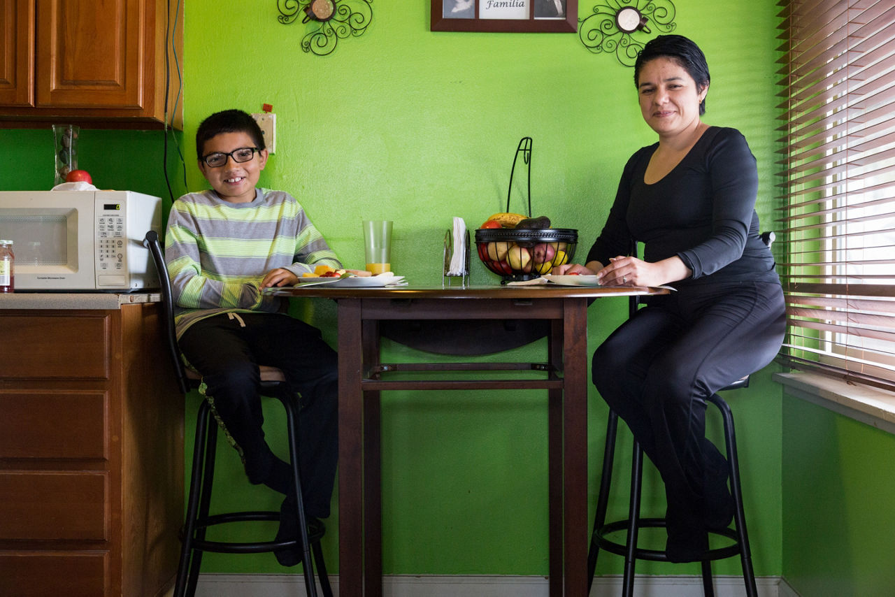 Lorena Medel at home with her son Chris. Medel is the recipient of a San Pablo scholarship to attend Contra Costa College. Having earned an associate degree, she plans to study business at San Francisco State University. “I know the struggles of being a student and mom,” Medel says. “Education is what will open opportunities.”