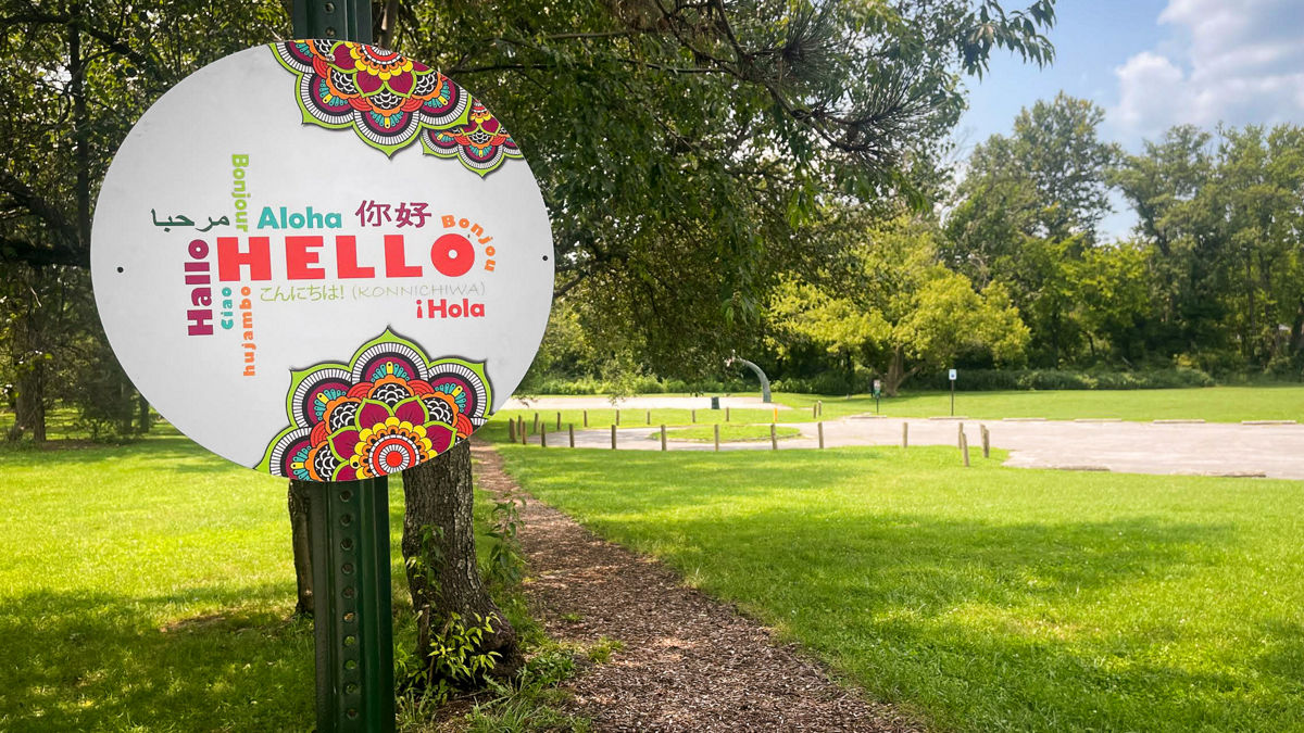A sign designed to welcome people of all nationalities and languages.