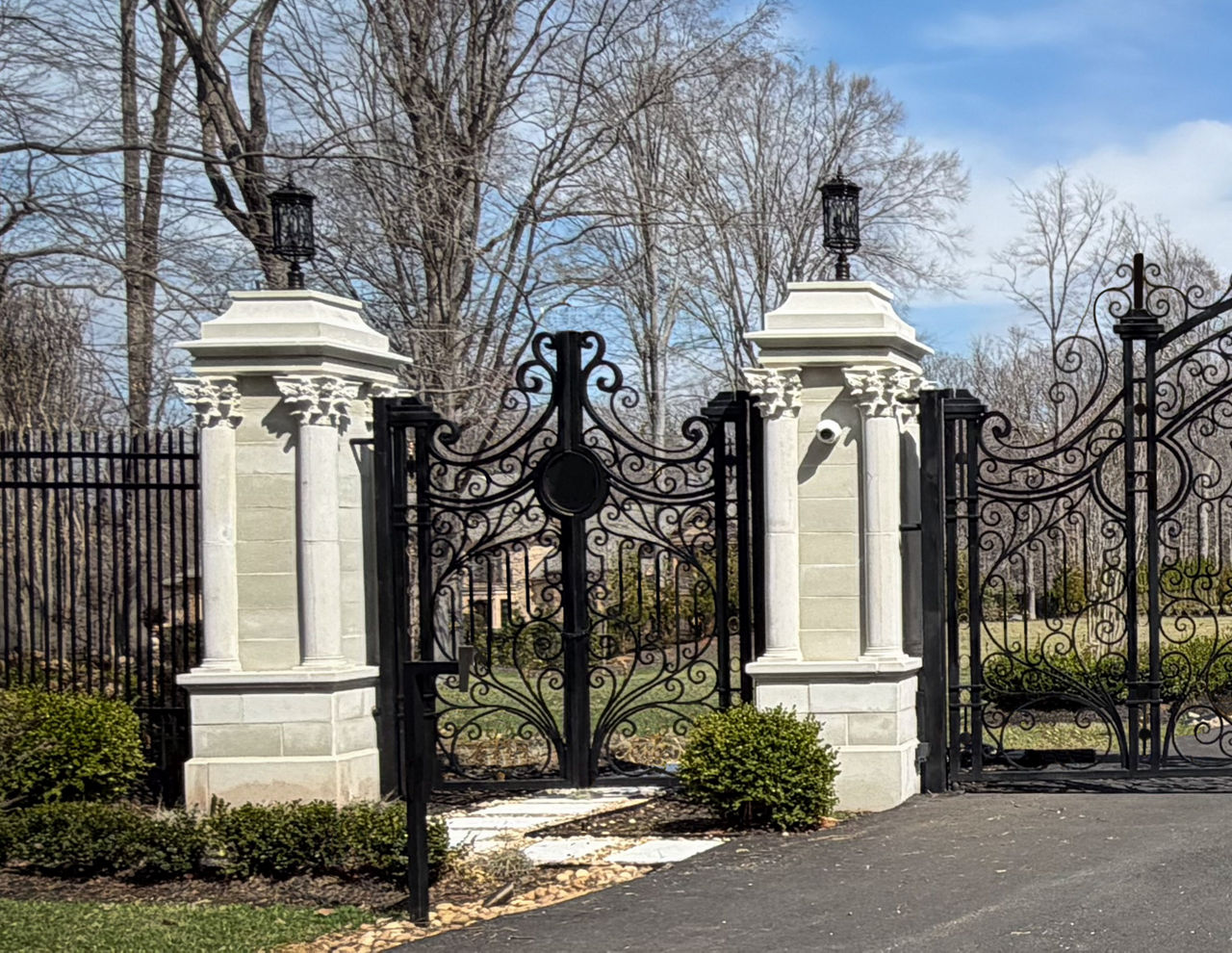An iron gate suspended by concrete columns in Great Falls, Virginia.