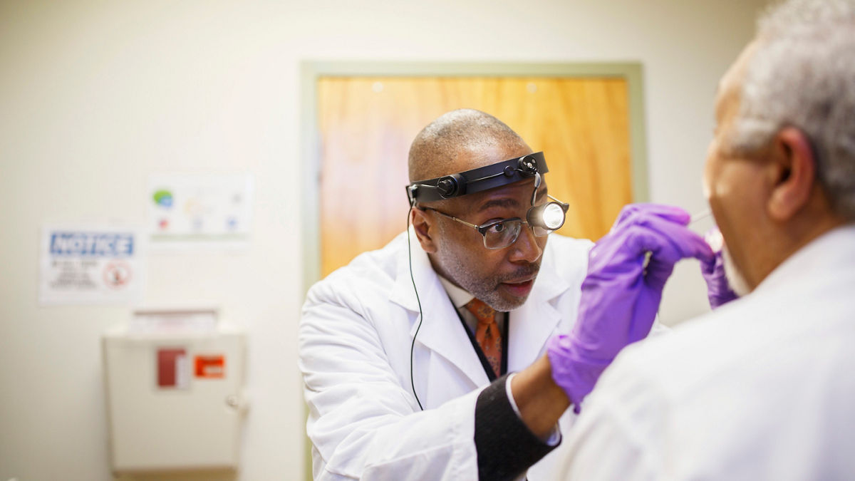 A doctor examining a patient.