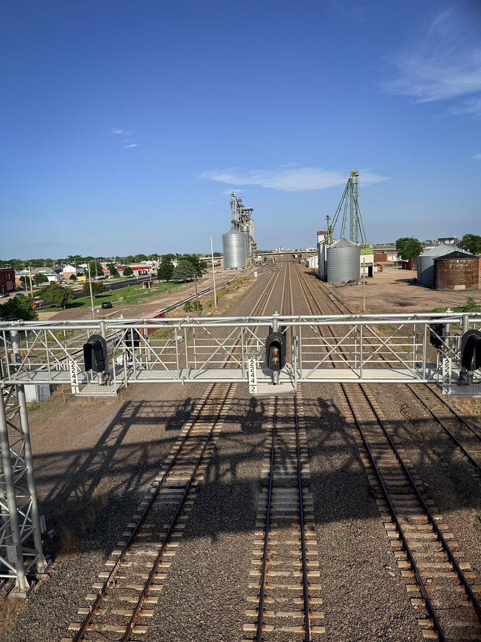 Railroad tracks beneath a brilliant blue sky in Lexington, Nebraska.