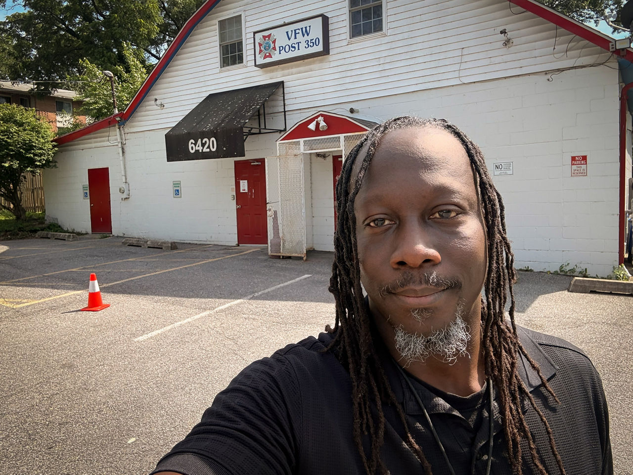 James standing in front of a VFW.