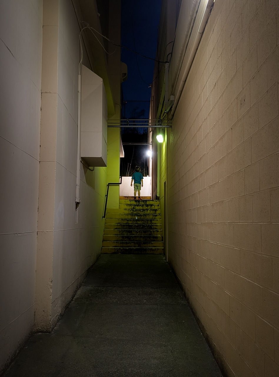 A bleak, dimly-lit high school hallway in The Dalles. 