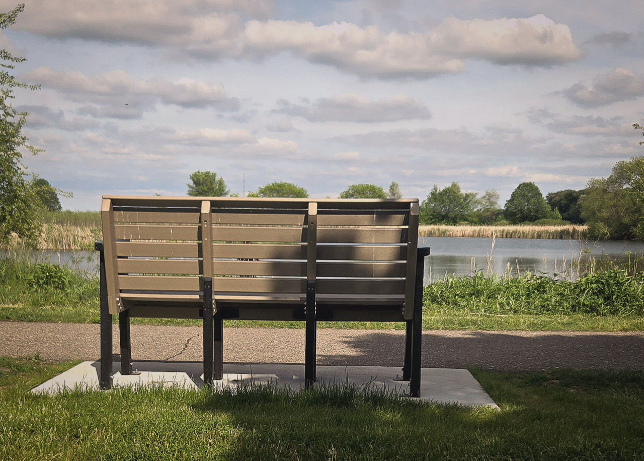 A photo of a memorial bench for someone who committed suicide.