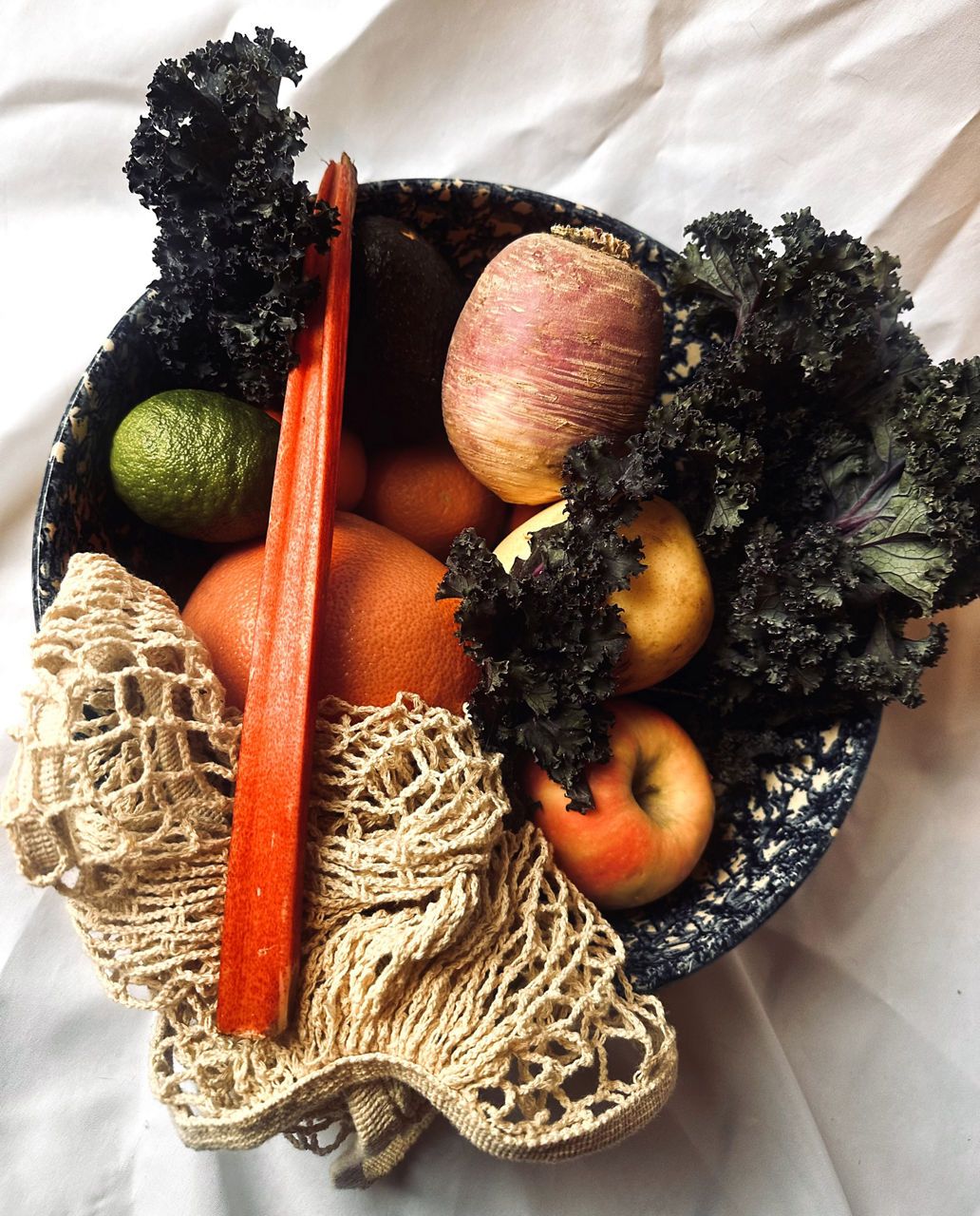 A beautiful bowl of fresh fruits and vegetables.