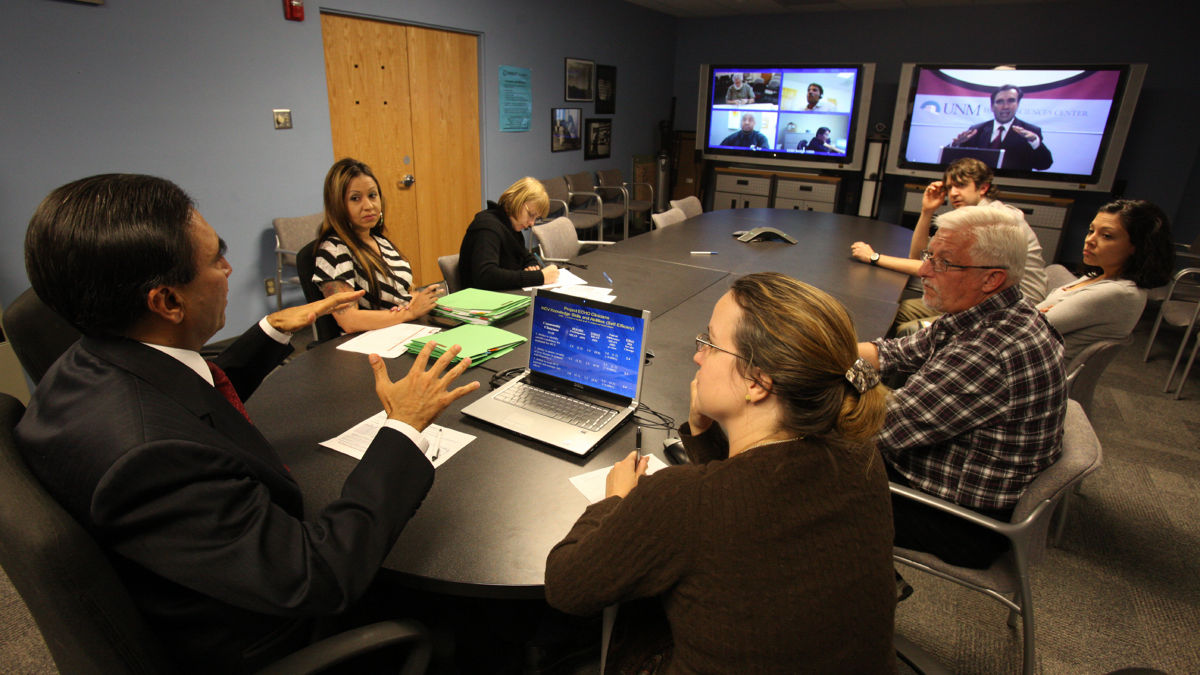Medical professionals at a video conferencing meeting.