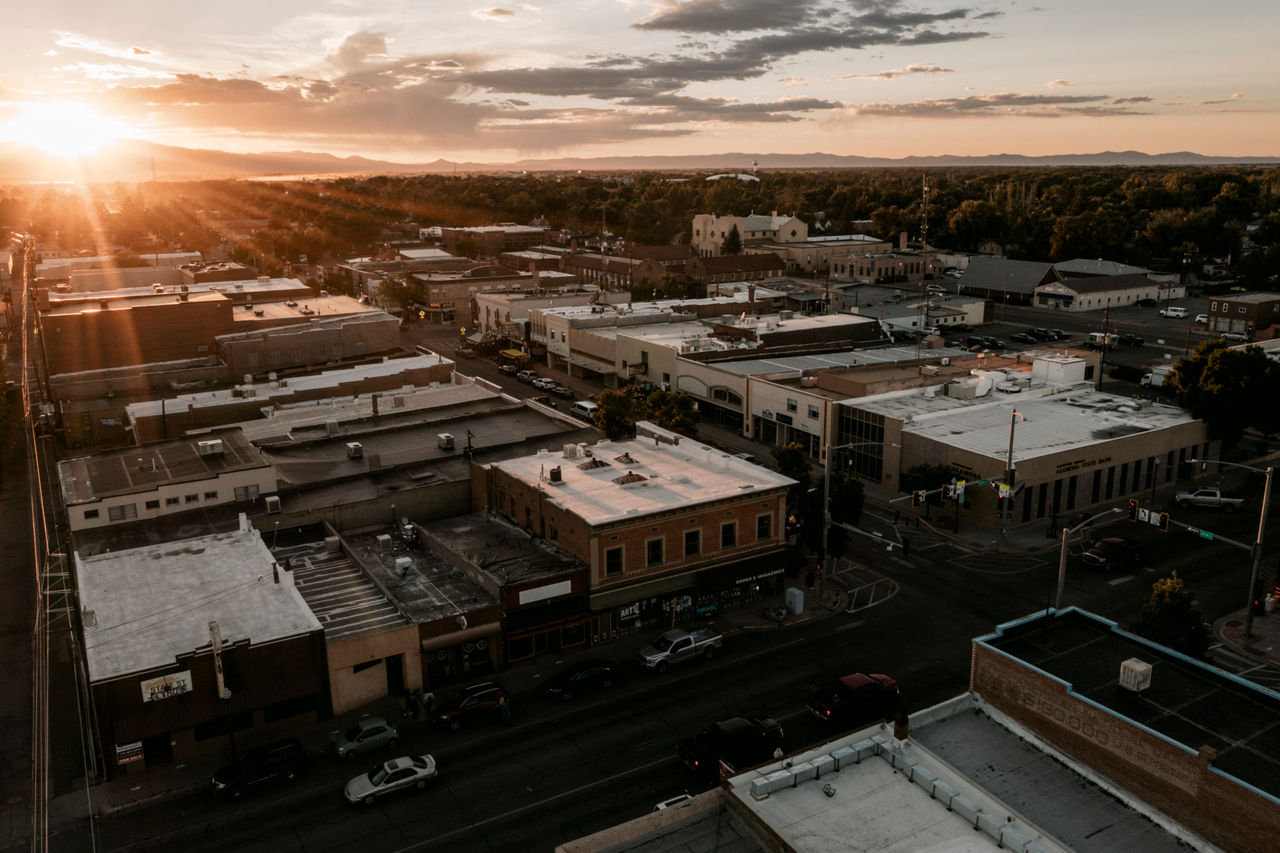 An aerial view of a town at sunset.