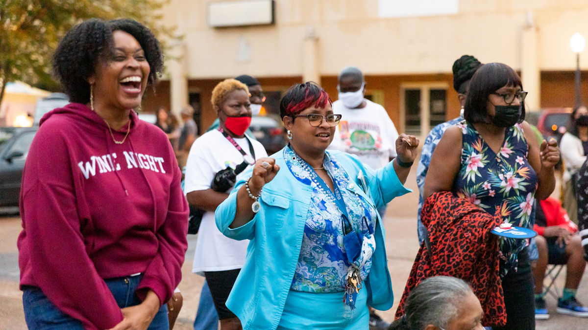 Mayor Melanie Townsend-Blackmon, center, dances at a community event with live music at the pavilion in downtown Drew, Mississippi.