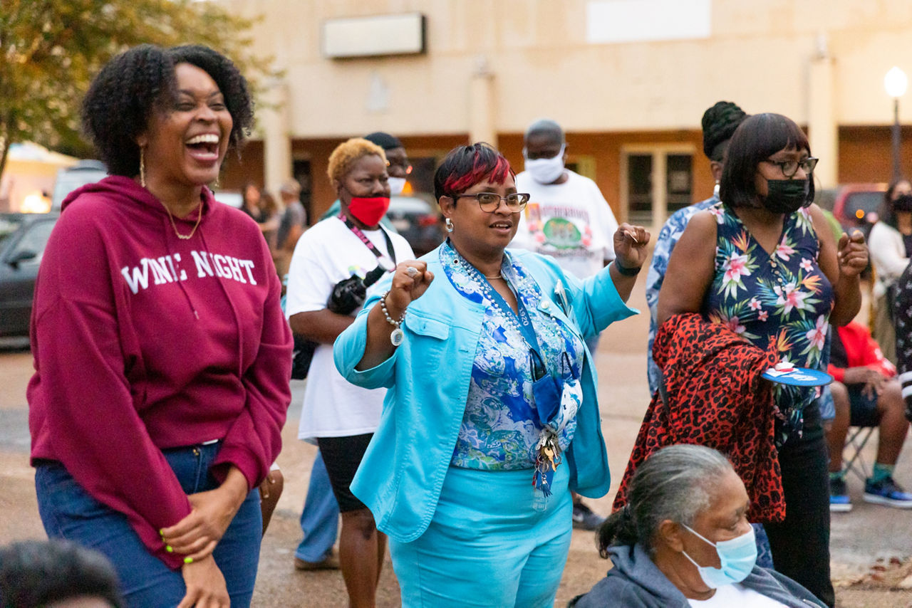 Mayor Melanie Townsend-Blackmon, center, dances at a community event with live music at the pavilion in downtown Drew, Mississippi.