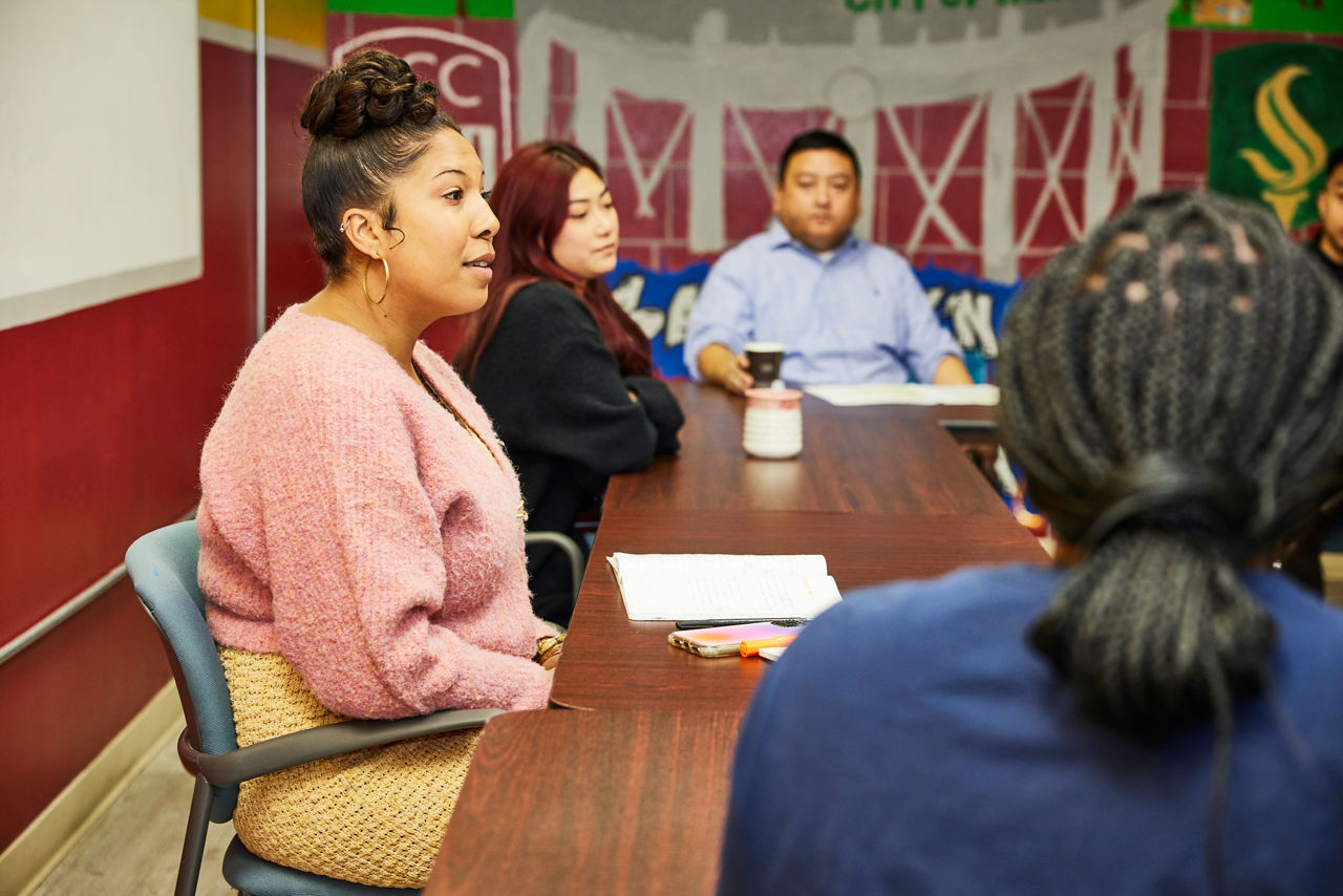 Nia MooreWeathers (L) Youth Justice and Equity Manager at Youth Forward, speaks at a community meeting held at East Bay Asian Youth Center (EBAYC), along with the center's Managing Director, Xia Lee (C). EBAYC is a hub of youth organizing, they serve youth of all backgrounds, specifically from underserved communities in South and North Sacramento and is a founding partner of the Sacramento Kids First Coalition.