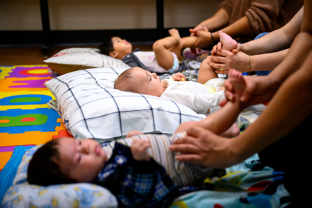 Babies receiving a massage at an infant messaging class.