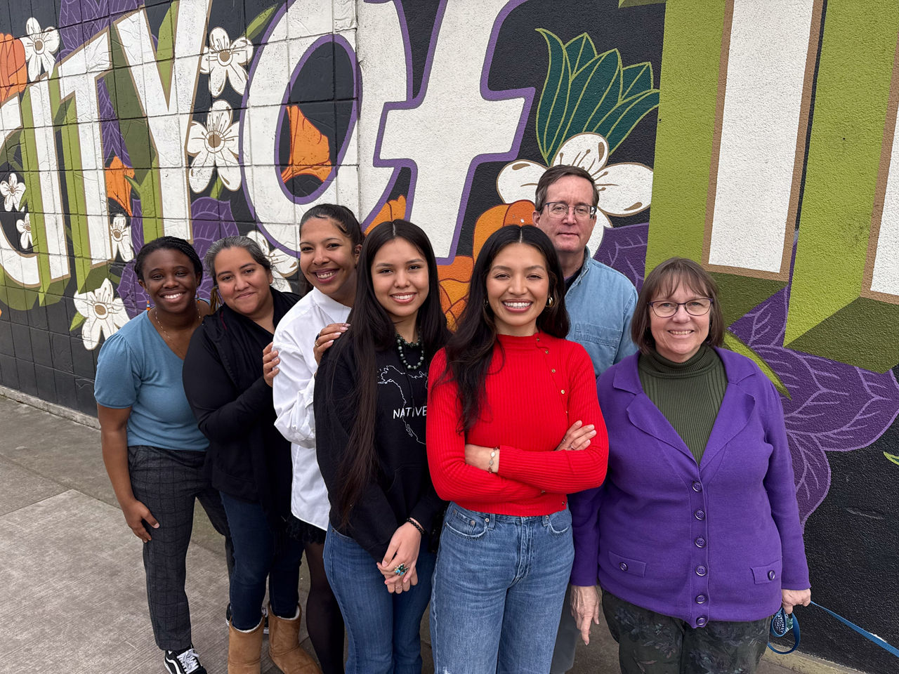 A team photo of Youth Forward at their oﬃce in Sacramento, Sarah Michael Gaston, Tona Miranda, Nia Moore-Weather, Lozen Miranda-Brightman, Monica Ruelas Mares, Jim Keddy and Barbara Harris.