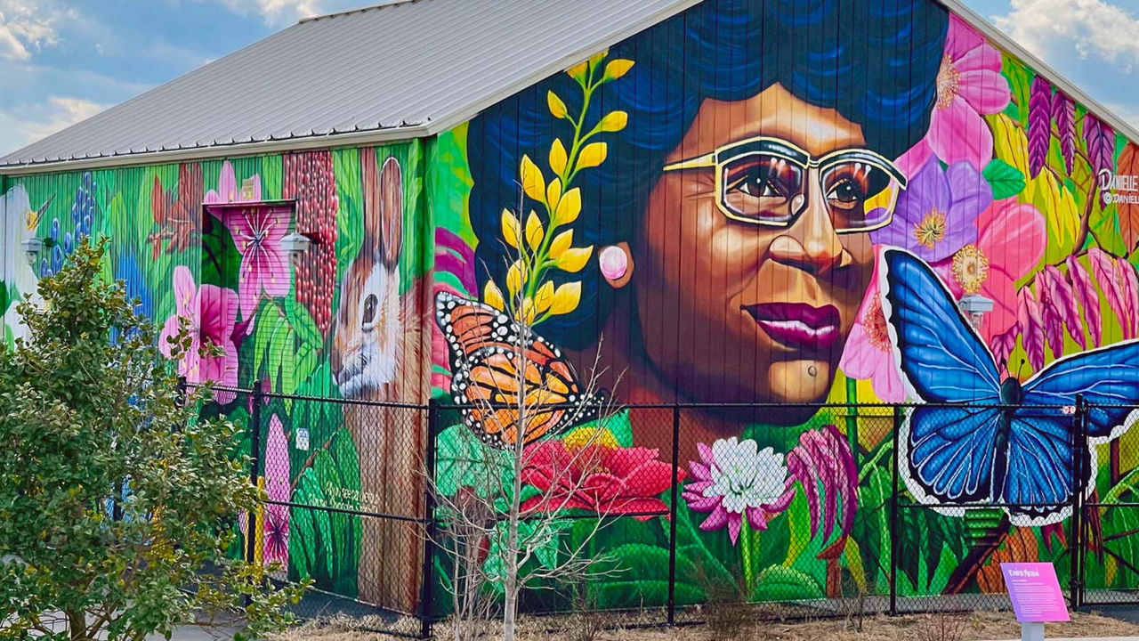 A colorful mural of Shirley Chisholm on a shed building in a Brooklyn  park named after the former U.S. Congresswoman.