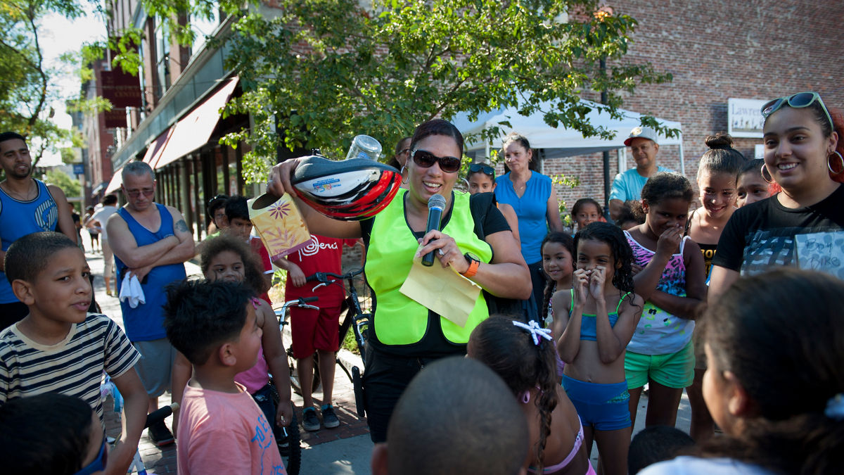 A community leader speaking at a neighborhood gathering.