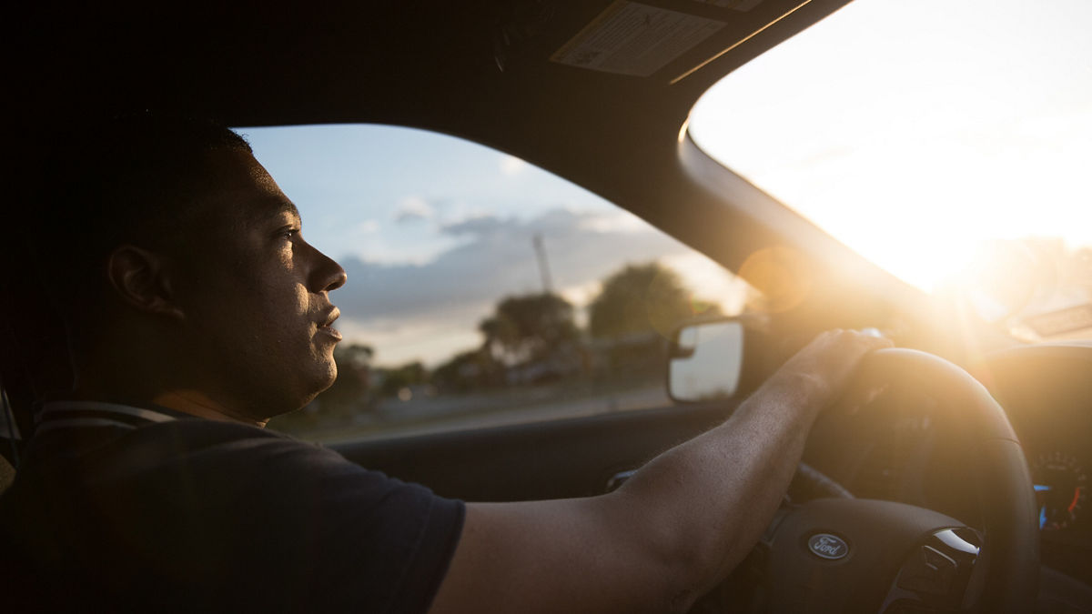 A man driving a car.
