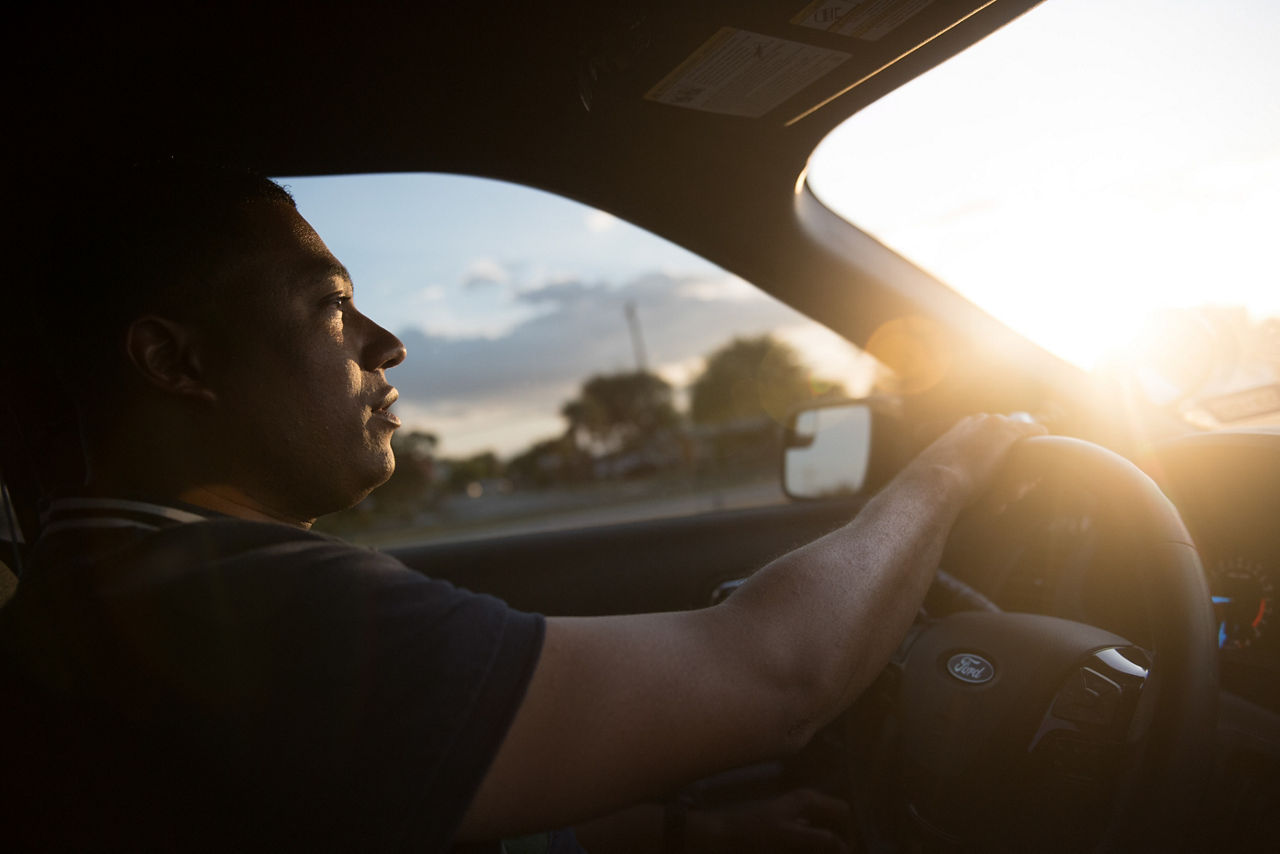 A man driving a car.