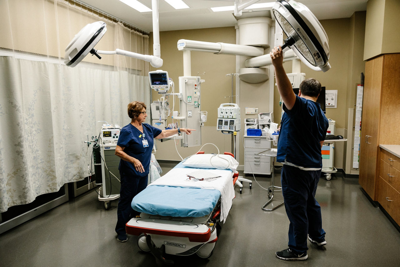 Nurses set up an emergency exam room. 
