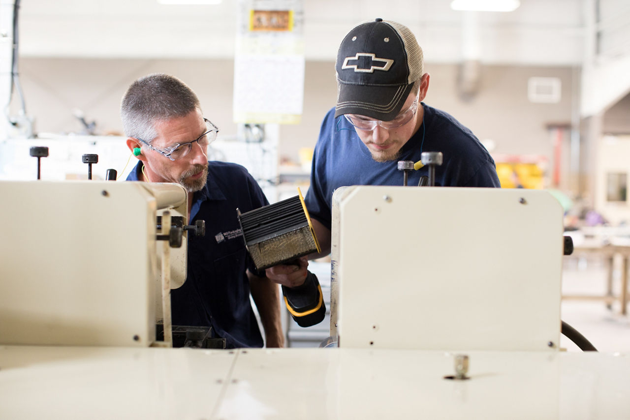 Algoma, WI COH 2017. Wolf Tech is a VoTech that enables high school students to recieve college credits.  Mark Zastrow (left) is a Press Operator at WS Packaging and teaches students at Wolf Tech. Justyn Krausslactt (right) learns the details associated with Flexo Printing.