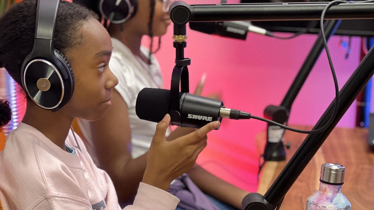 Youngsters in front of microphones, part of the Young Futurists Project.