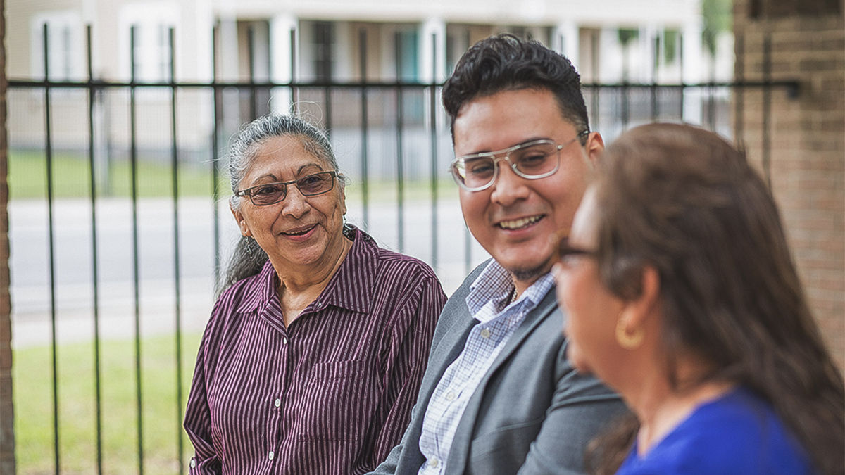 San Antonio, 2019. Silvia Gonzales (right) received assistance with help transferring a house title that she was otherwsie unable to naviagte heerself. She was in danger of losing the house and the financial benefits that come with it as she could not afford a lawyer. Mary Carrillo's (left) parents passed away and left their house in Mary's brothers name. When this brother passed away Mary was left in the dark on what to do. MAUC helped transfer the title to her name.  Daniel Ibarra (left) was originally born in Mexico and came to the United States when he was 2. He was undocumented until age 8. Daniel was awarded a college scholorship program through MAUC and interend there for 3 summers. He now is a full time employee at MAUC and has the title of Housing Coordinater. He teaches several classes for the organization as well. MAUC stands for Mexican American Unity Council.