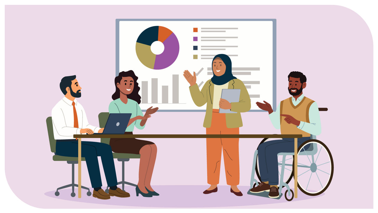 A diverse group of colleagues sit around a conference table, smiling and talking together. Behind them, a large whiteboard displays charts and notes.