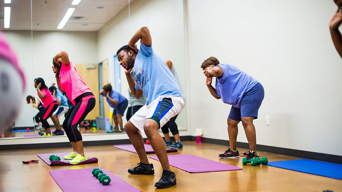 Adults exercising at a community class.