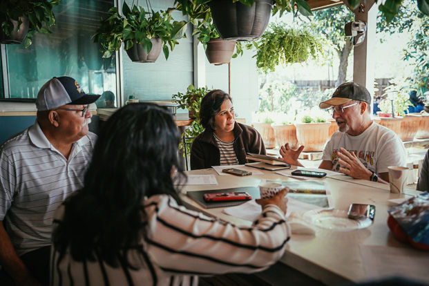 Neighbors meet to discuss the transformation of a flood zone into a community recreation park as part of a climate resiliency project.