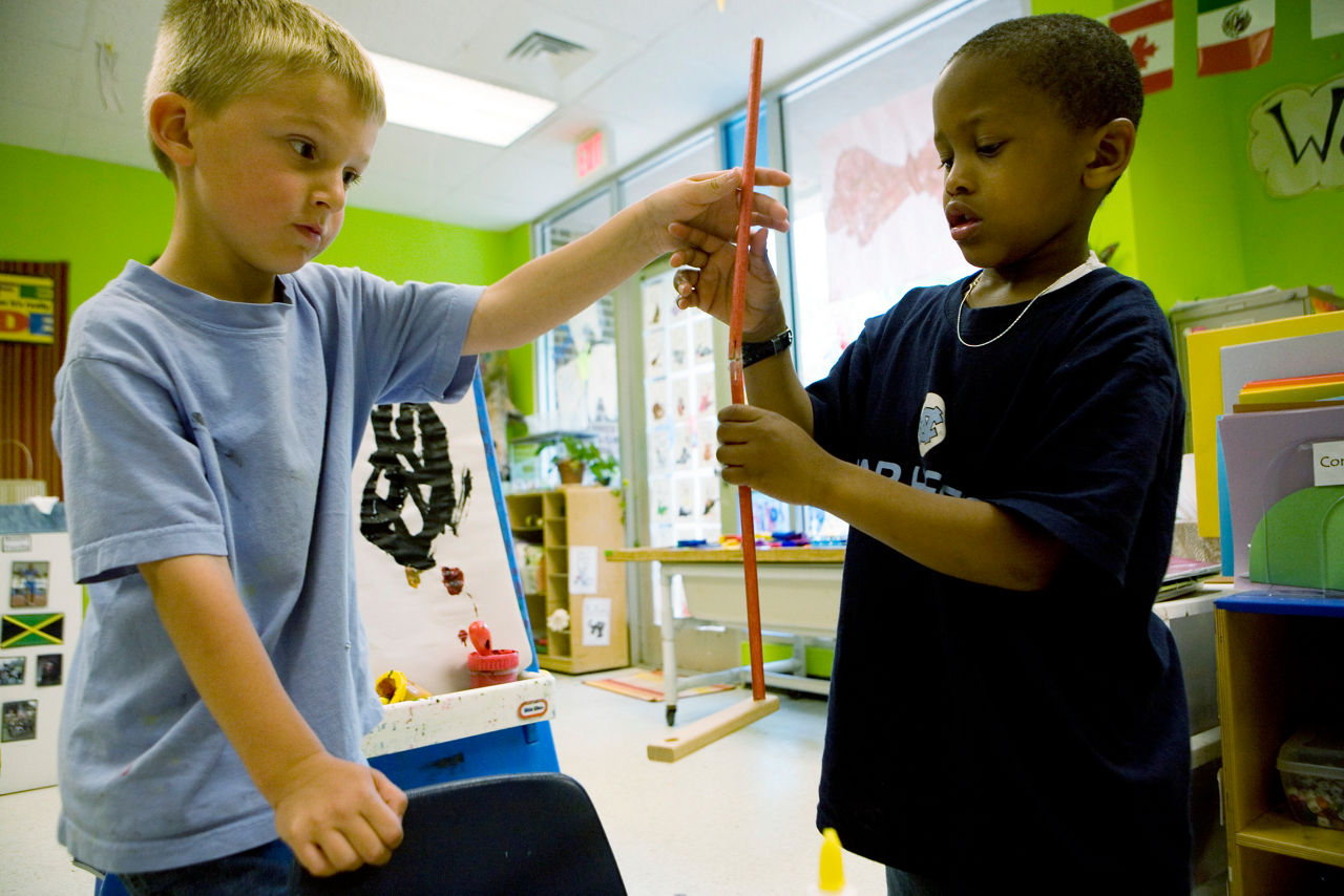 Joshua Singleton and classmate make golf clubs from building toys.  Frank Porter Graham Child Development Center. Chapel Hill, North Carolina. Commission to Build a Healthier America.