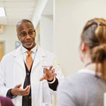 Dr. Charles Moore gives a tour to medical residents Lyndsi Paumen and Stefani Su at the HEALing Community Center in Atlanta, Ga. on Wednesday, March 14, 2018.