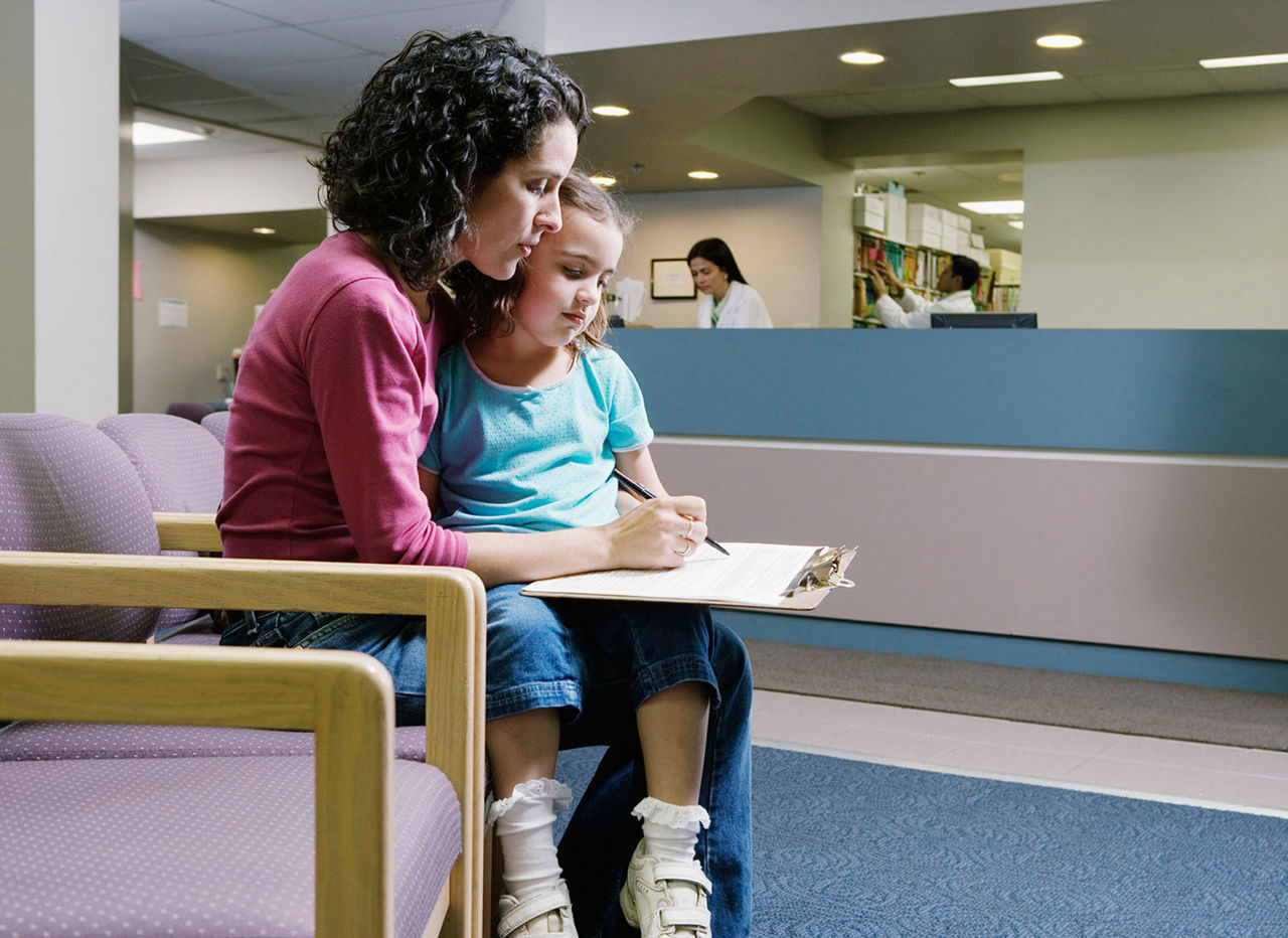 A mother and child in doctor's waiting room.