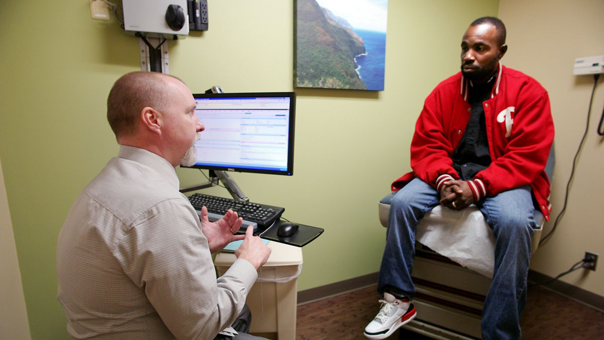 Lamont Taylor (red Phillies jacket) and his mother, Gloria Taylor (gold pantsuit) ÑLamont is a long term patient of Dr. WallerÕs.,Lamont Taylor (red Phillies jacket) and his mother, Gloria Taylor (gold pantsuit) —Lamont is a long term patient of Dr. Waller’s. AF4Q Grand Rapids